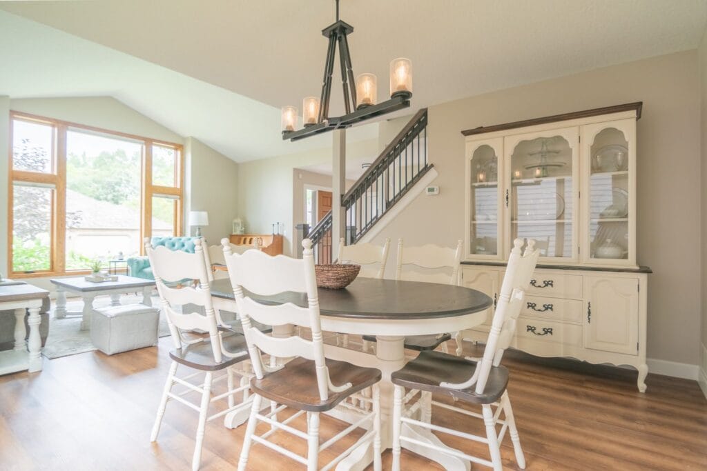 Dinning room with a dry sink and farm house style light fixtures.
